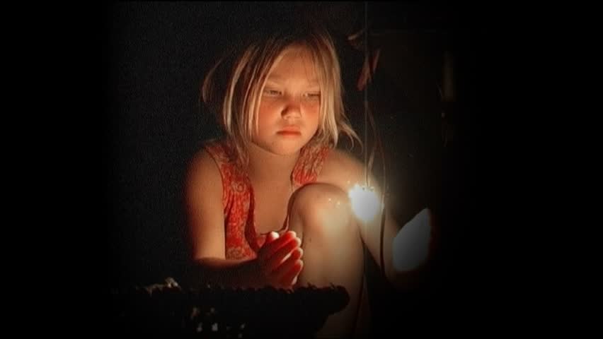 Girl holding light in hands
