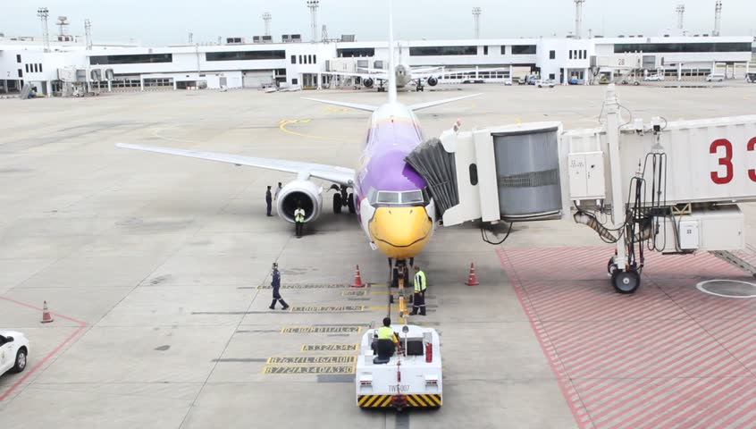 BANGKOK - CIRCA AUGUST 2012: A plane from the airline Nok Air on the tarmac at Suvarnabhuni International airport circa August 2012 in Bangkok, Thailand.