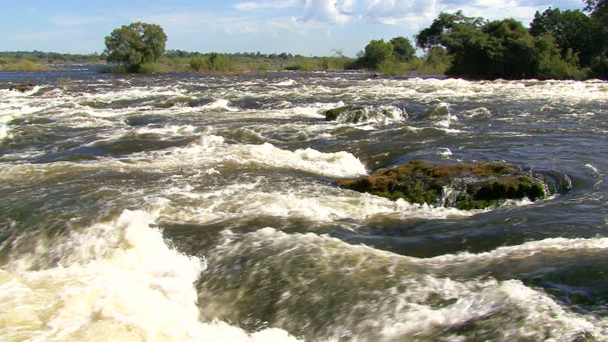 Current flowing over rocks of Victoria Falls, South Africa
