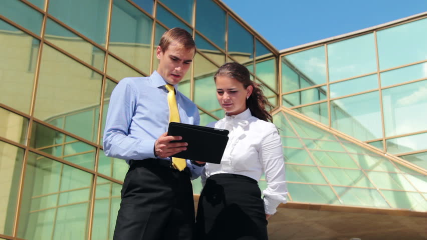 Business conversation: two businesspeople discussing work