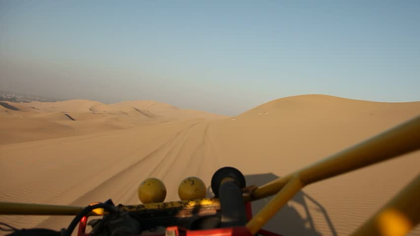 video footage of driving with a buggy off-road in the dunes of Ica, Peru