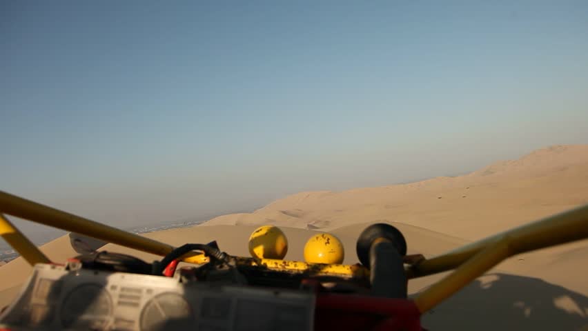 video footage of driving with a buggy off-road in the dunes of Ica, Peru