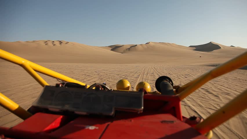 video footage of driving with a buggy off-road in the dunes of Ica, Peru