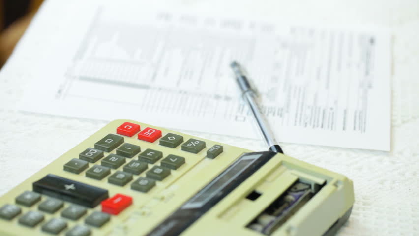Doing taxes with a big accounting calculator