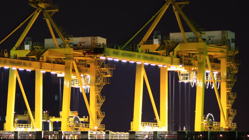 Cargo ship moving load at port Time lapse