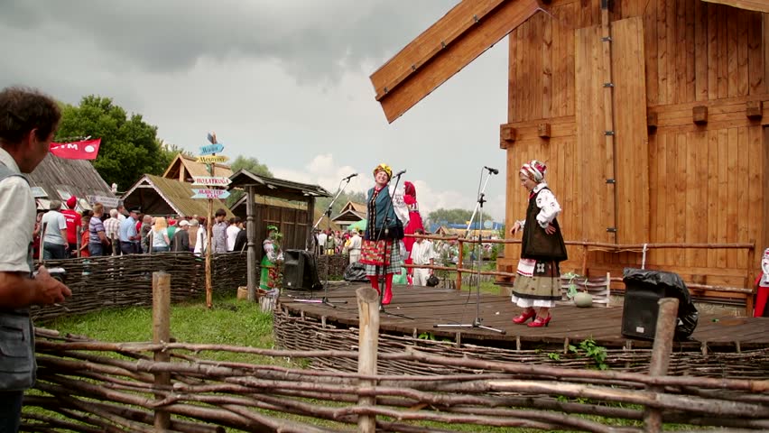VELYKI SOROCHYNTSI, UKRAINE - AUGUST 17: Performers onstage at the Sorochyntsy Fair on August 17, 2012 in Velyki Sorochyntsi, Ukraine. This large fair has been held every year since the end of Soviet rule and was declared Ukraine's national trade fair.