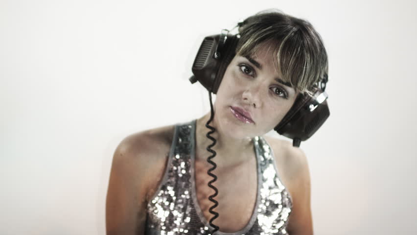 sexy cool blond woman dances with headphones, motion time warp effect added