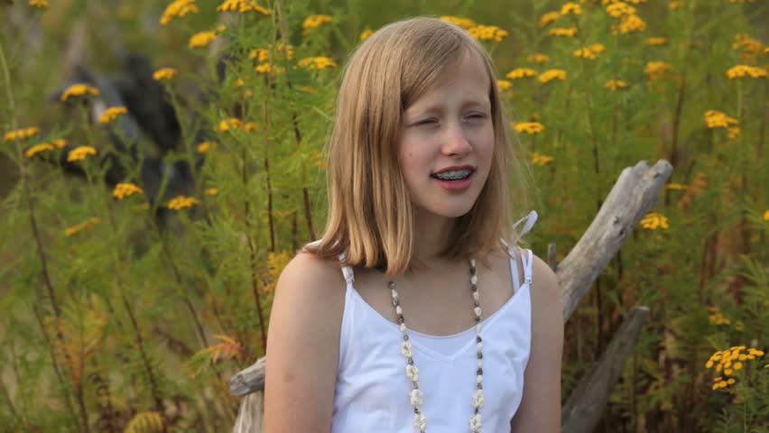 Young girl sneezing