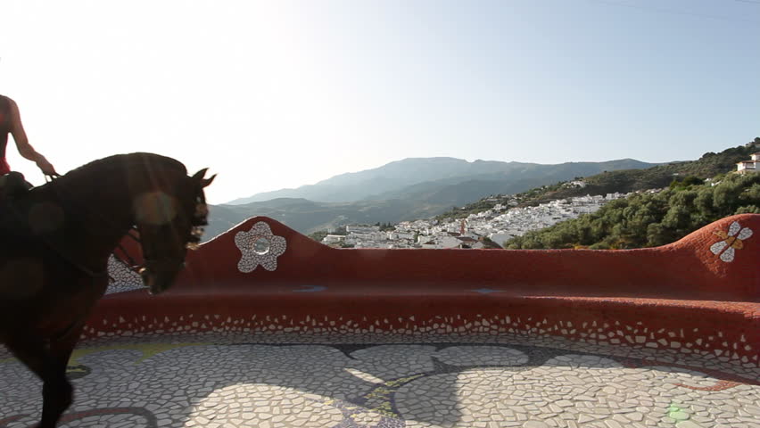 Woman riding a horse in Andalusia, Spain