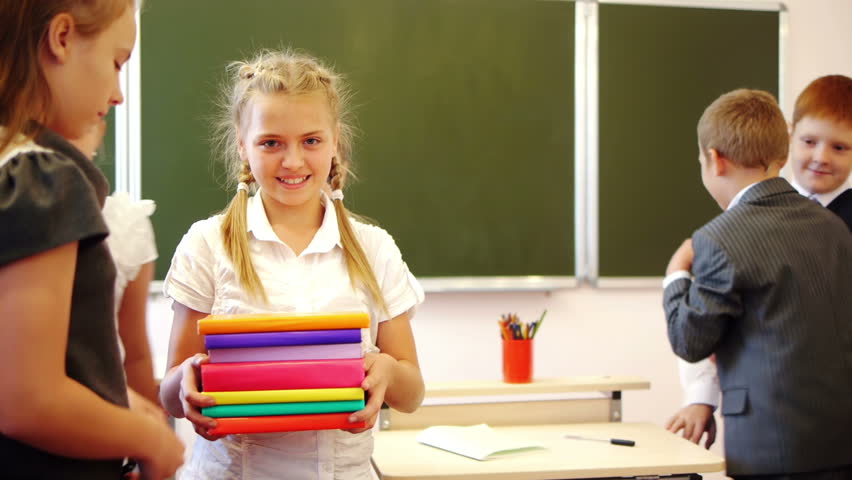 Schoolgirl holding books and classmates taking them