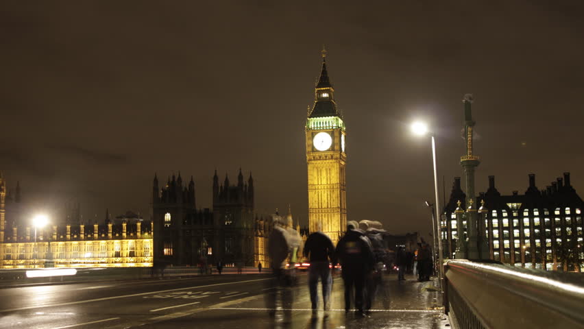 stopmotion of people and vehicles on westminster bridge, london, on a rainy night