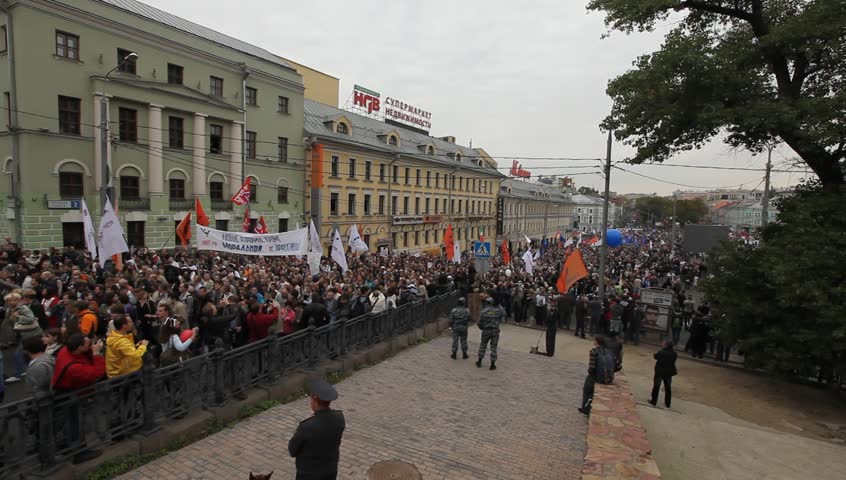 MOSCOW - SEPTEMBER 15: Opposition activists and supporters take part in an anti-Putin protest on September 15, 2012 in Moscow, Russia. Thousands marched through Moscow to protest against the rule of V.Putin.