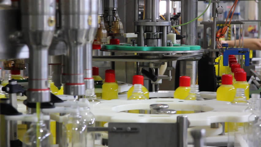 Liquid detergent on automated production line. Machinery for bottling