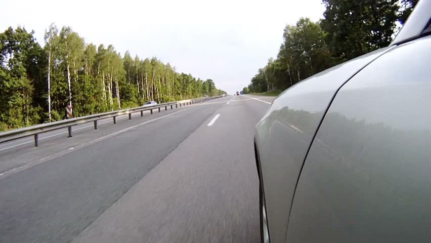 VOLOGDA - JUN 28: Cars go quickly on high-speed highway, on Jun 28, 2011 in Vologda, Russia. General extent of highway M-8 Moscow - Yaroslavl - Vologda - Arkhangelsk makes 1271 km