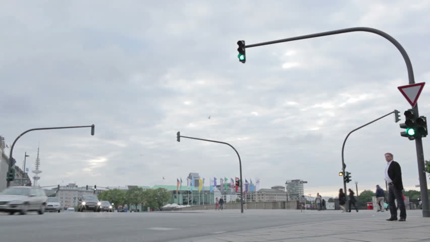 HAMBURG - JUNE 3: Time lapse crossroads, traffic lights and pedestrians on June 3, 2012 in Hamburg, Germany.