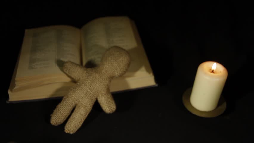 Sorcerer voodoo doll with a pin pierces