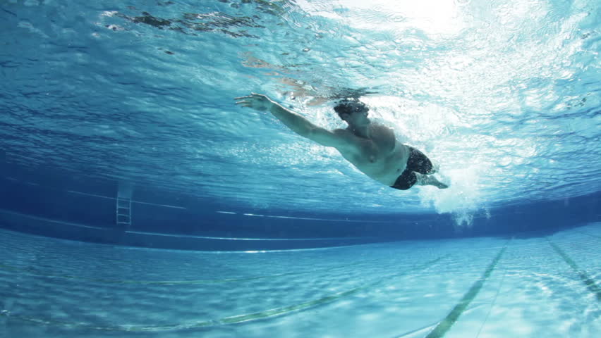 underwater view male freestyle swimmer in pool
