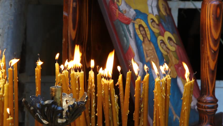 QASR AL YAHUD, ISRAEL â JANUARY 18: Greek Orthodox pilgrims lit candles at baptismal site during the Epiphany at Qasr Al Yahud, Israel, January 18 2012