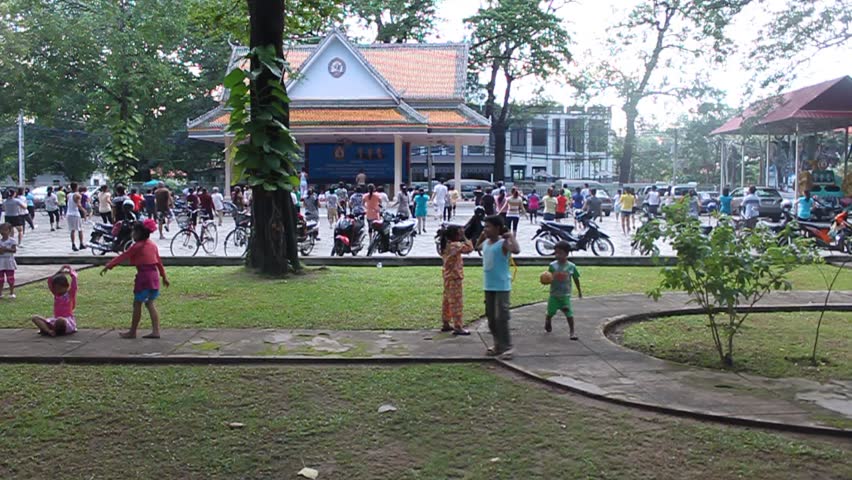 SIEM REAP, CAMBODIA - JULY 13: Local people perform aerobics on public on July 13, 2012 in Siem Reap, Cambodia.