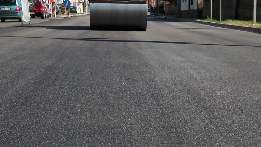 Road Roller in Action. Paving and compacting new asphalt. HD1080p.