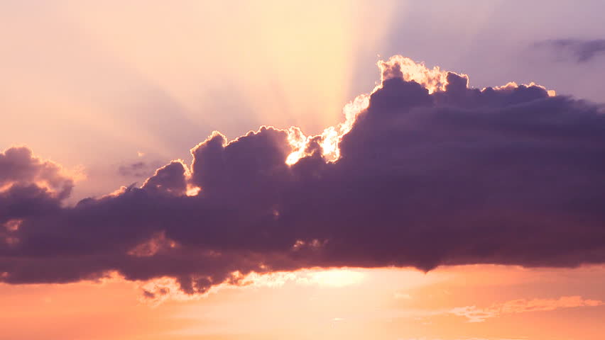 Time lapse of divine light through storm clouds