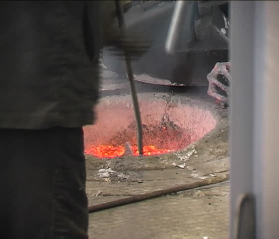 molten metal being removed from the oven