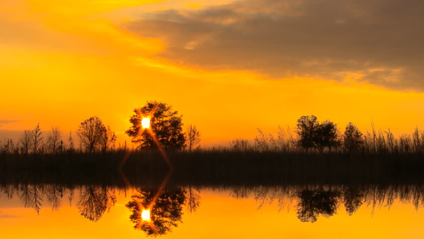 Sunset with beautiful clouds in reflexion.