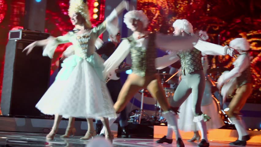 MOSCOW - DEC 17: Vadim Kazachenko sings on stage with ballet dancers during concert of Legend RetroFM in Sports complex Olimpiyskiy, on Dec 17, 2011 in Moscow, Russia