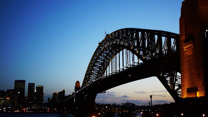 a time lapse of the lights on sydney harbour bridge coming on