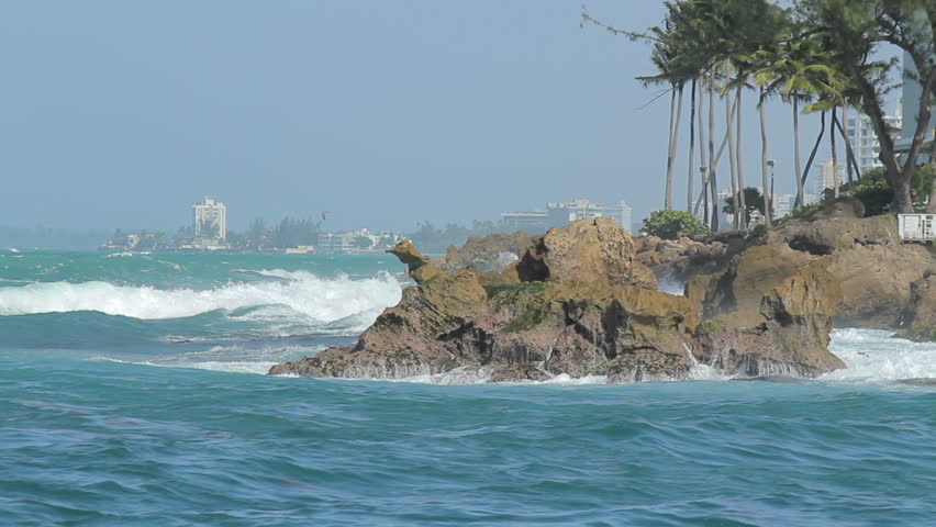 Waves smashing against Dog Rock in Condado. Legend of the dog that turned into a rock awaiting for his master a fisherman centuries ago.