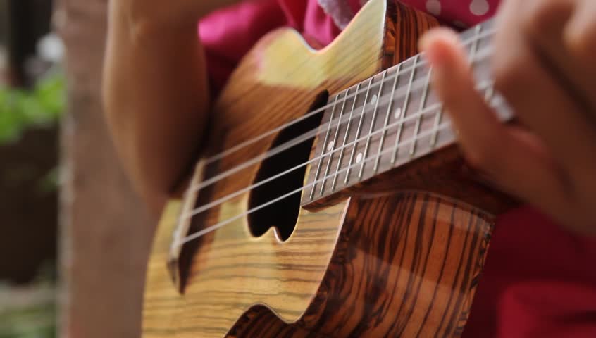 playing ukulele soft focus