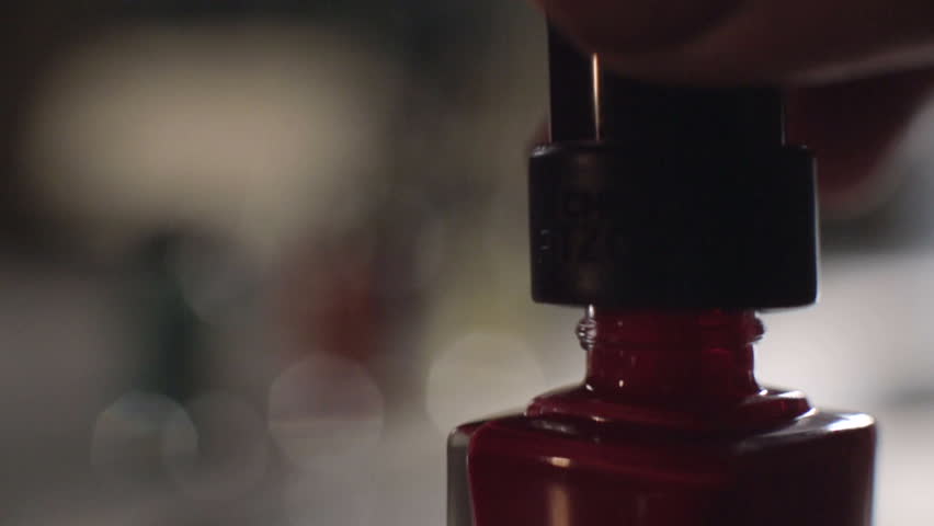 Opens red nail polish