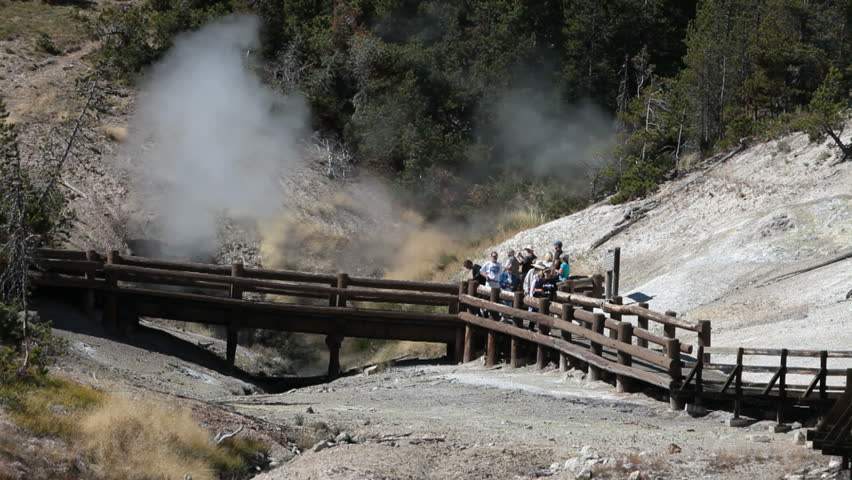 YELLOWSTONE NATIONAL PARK, WYOMING CIRCA 2009: One of the worlds most visited nature and geological parks. Mud Dragon Hot Springs area boardwalk. Hot steam geothermal feature.