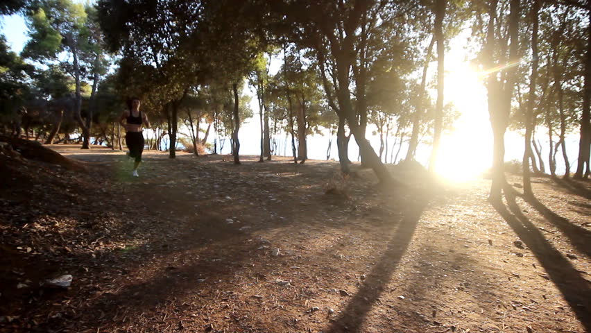 Woman running
	
Description: Woman running through the forest
