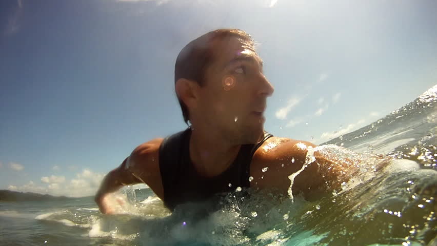 A Man Risking His Life Surfing in Dangerous Waves