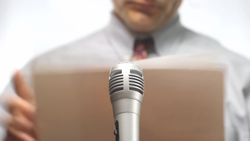 press conference, microphone and spokesman with nothing to say