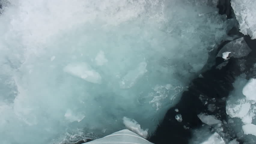 Icebreaker breaking ice floe in the Canadian High Arctic. Realtime.