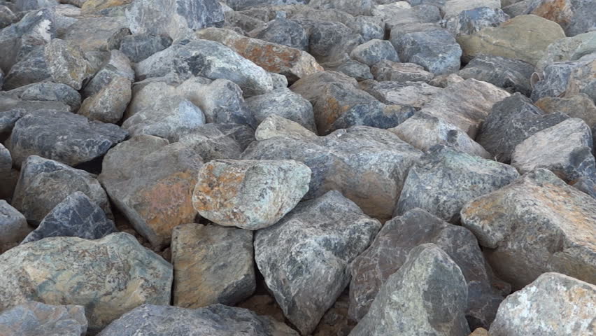 Panning shot of granite boulders under Wilson bridge in Washington DC as background HD 1080p