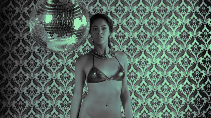 sensual shot of a beautiful woman dancing, covering her body with her hands