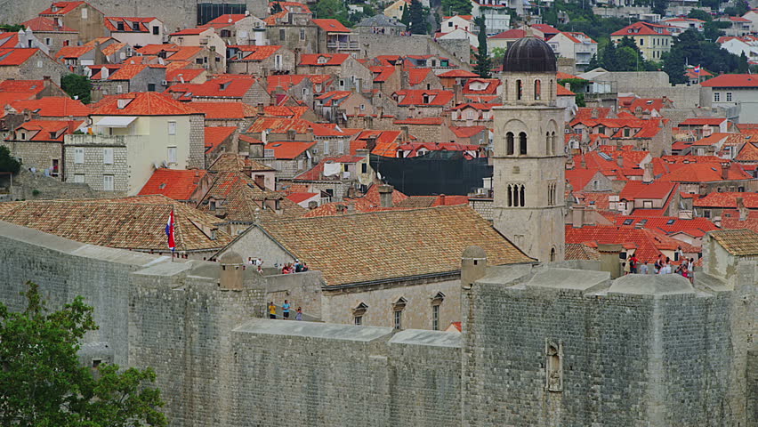 Dubrovnik old town walls with bell tower of Franciscan monastery, Croatia