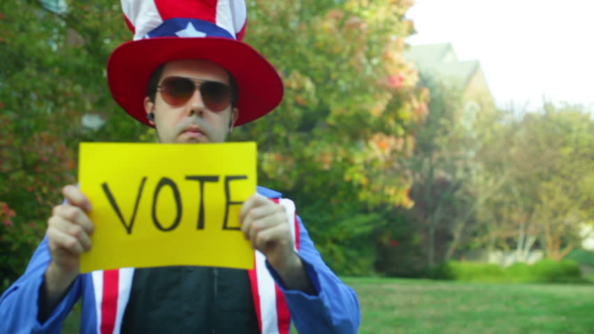 uncle sam costume guy, with a vote sign