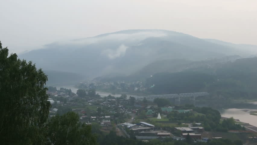 Panoramic view on the river Yenisei, covered by haze of forest fires (02). Russia, Siberia, near village of Ust-Mana (Divnogorsk, Krasnoyarsk territory), summer evening of August 2012.