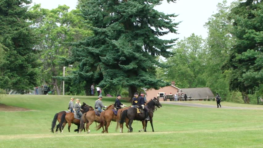 PORT GAMBLE, WA - JUN 20 -  	Union and Confederate cavalry maneuver in open field		in a mock battle at Port Gamble WA on Jun 20, 2009.

