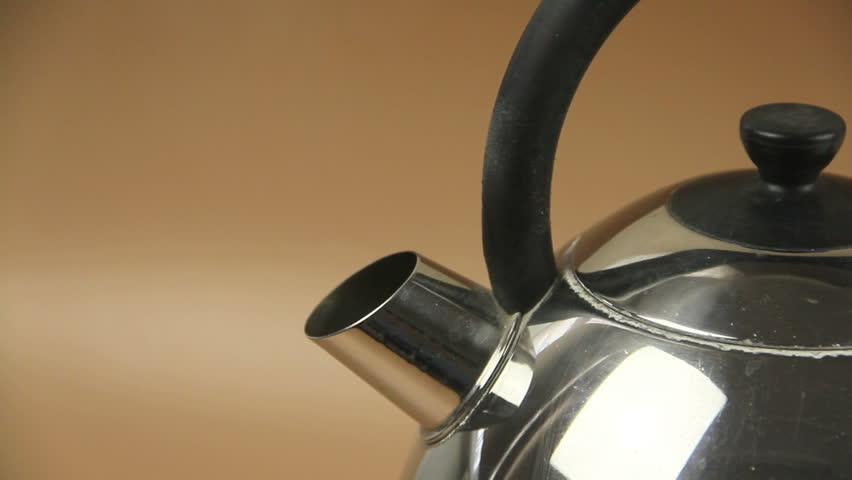 Boiling water in a an electric jug then dipping a tea bag in a mug.