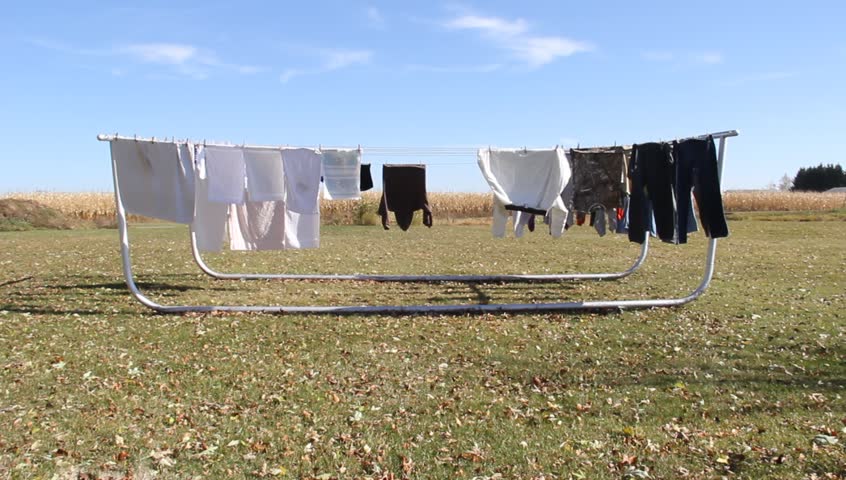 laundry drying and blowing on an outdoor clothesline