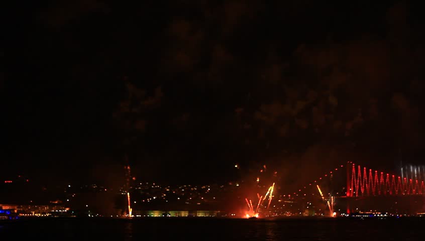 Istanbul with full of fireworks and smoke.  View of the Ortakoy region and part of the Bosporus Bridge. 
