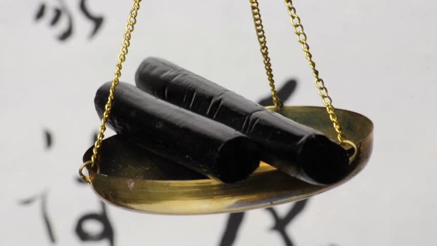 licorice, processed sticks and raw cuts on a balance