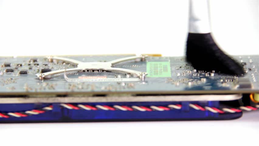 Computer Graphic hardware, older inputs for DVI and S-Video. One card with no cooling hardware. Cleaning dust with brush.