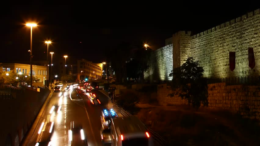 JERUSALEM, ISRAEL - NOVEMBER 01: Drivers, commuters and tourists hurry to their destinations during rush hour near the wall of Jerusalem, time lapse view, Israel, 01 November 2012