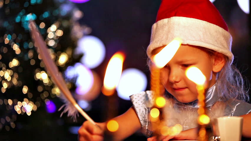 Letter to Santa Claus. Girl writing with quill pen. Xmas concept
